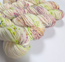 Load image into Gallery viewer, Lime and purple speckles on superwash merino slub, chunky weight yarn.
