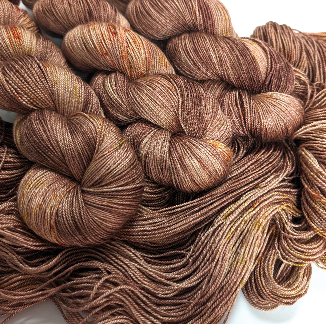 Speckled brown, on baby camel/silk 4ply/fingering weight yarn.