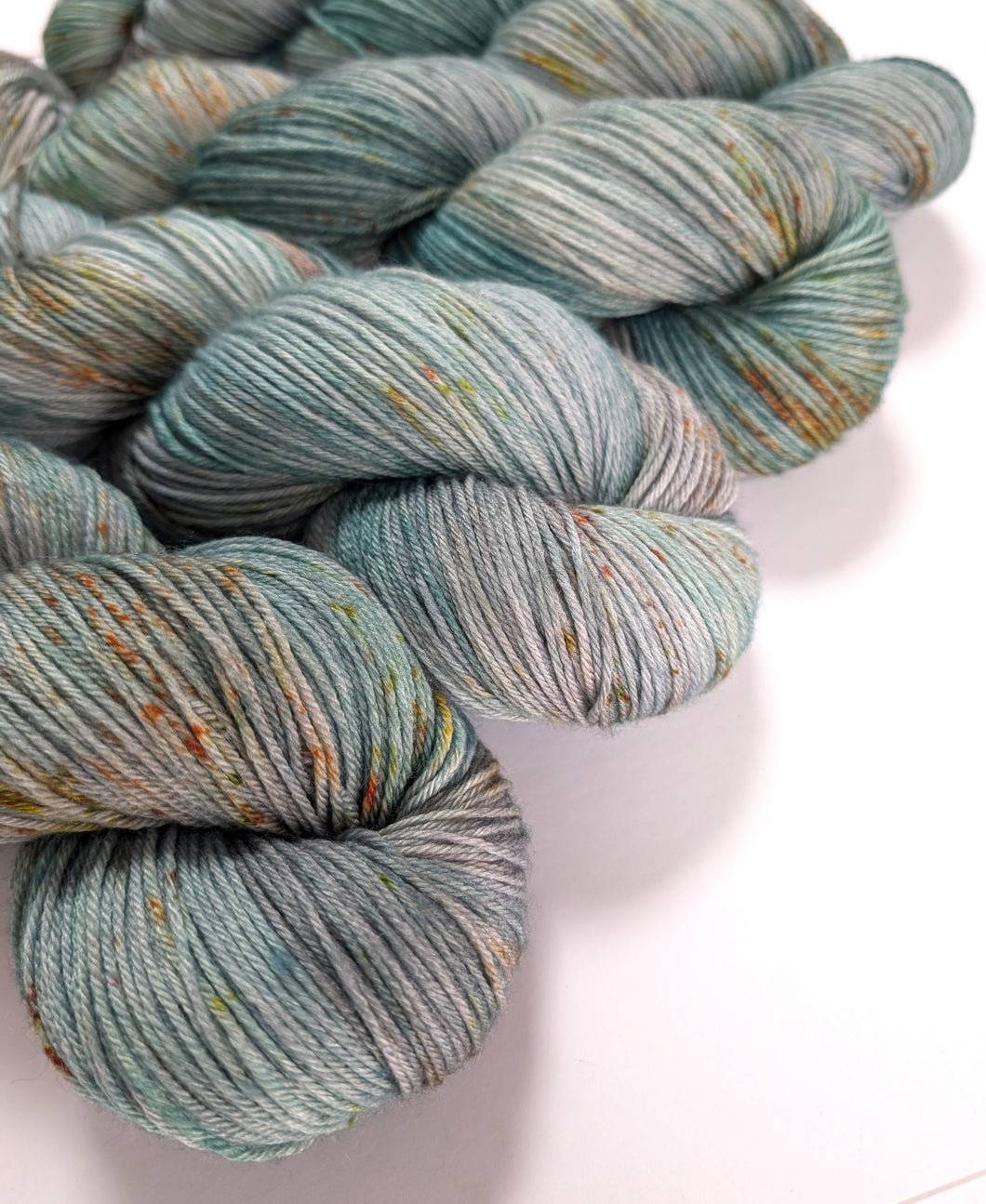 Speckled greens on superwash merino/bamboo 4ply/fingering weight.