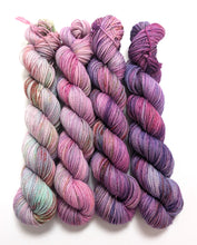 Load image into Gallery viewer, Pinks and purples gradient yarn set on a superwash merino/nylon/sparkle sock yarn.
