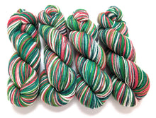 Load image into Gallery viewer, Holly Jolly Christmas on Talamh sock yarn.
