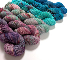 Load image into Gallery viewer, Multi coloured gradient yarn set on superwash merino/nylon/sparkle sock yarn.
