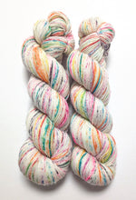 Load image into Gallery viewer, Advent Speckles on a Superwash Merino/Nylon/Sparkle sock yarn.
