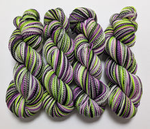 Load image into Gallery viewer, Beetlejuice on high twist superwash merino/nylon &quot;Zebra&quot; sock yarn.
