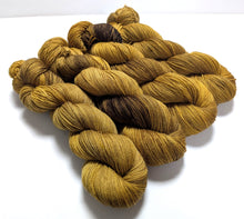 Load image into Gallery viewer, Old Gold on superwash BFL/nylon sock yarn.
